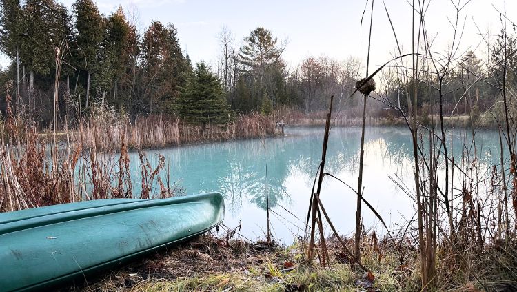 canoe beside a lake at a silent retreat