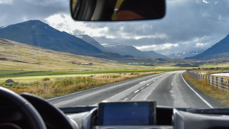 view of landscape through car windshield