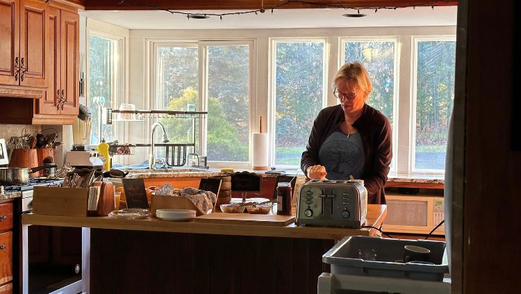 woman preparing breakfast at a silent retreat