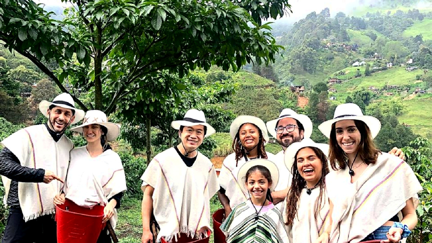 group of solo travelers on a coffee farm tour in medellin