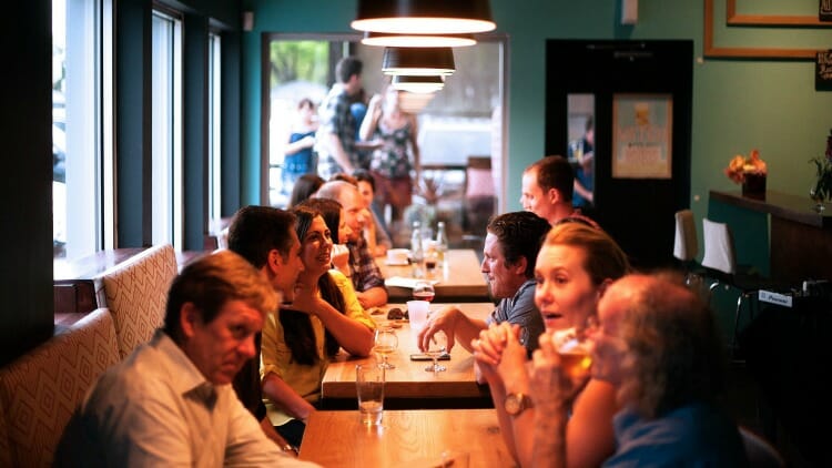 Strangers helping strangers by inviting them to dinner.