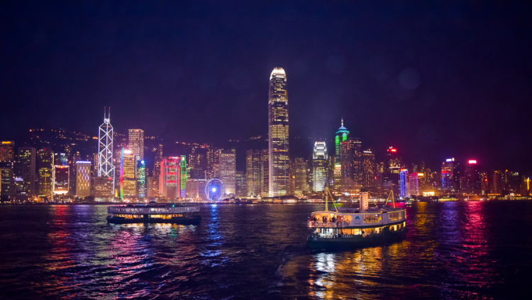 this image of a boat crusing at night shows another activity option for solo travelers at night